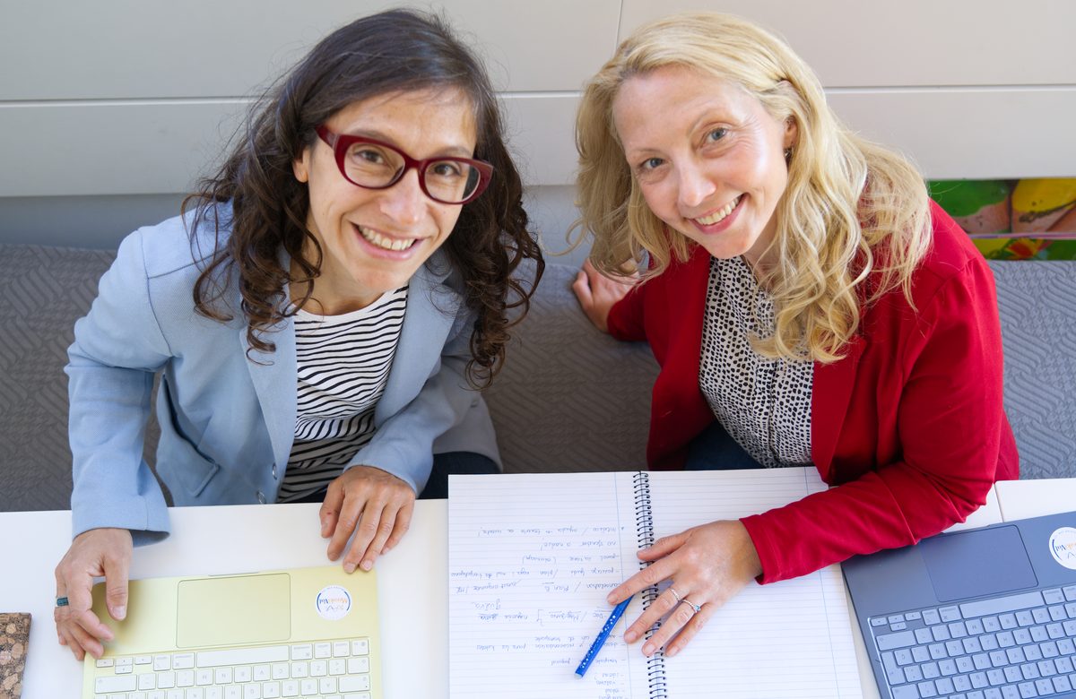 Olivera and Sara working at desk